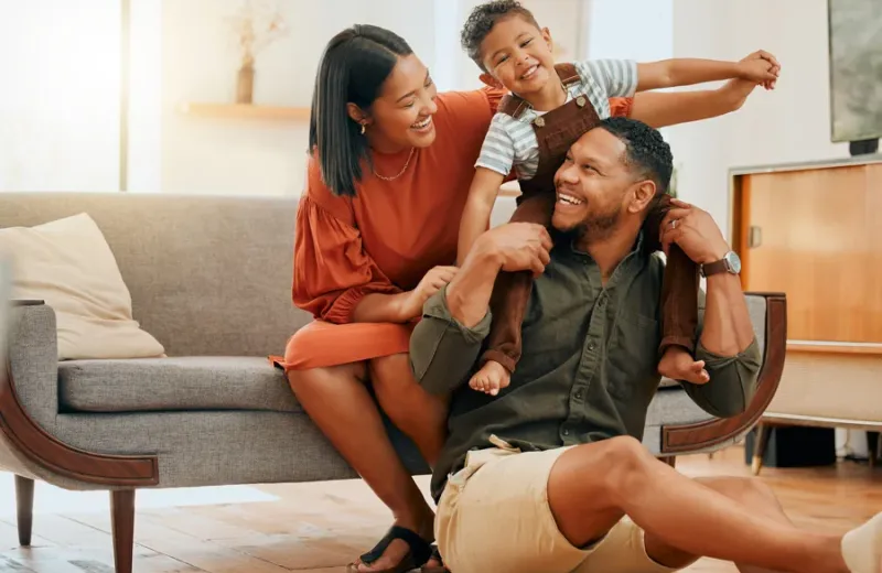 family laughing and playing in pest free home