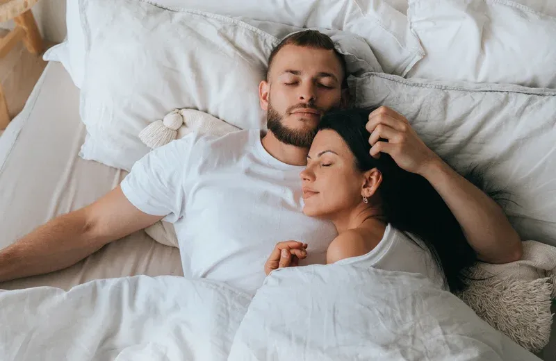 couple sleeping in bed bug free bed in their home