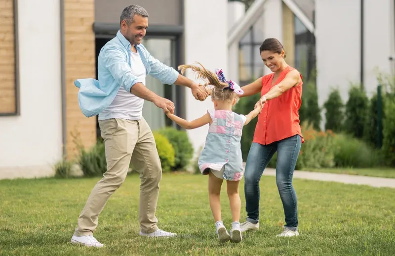 family playing outside mosquito free yard