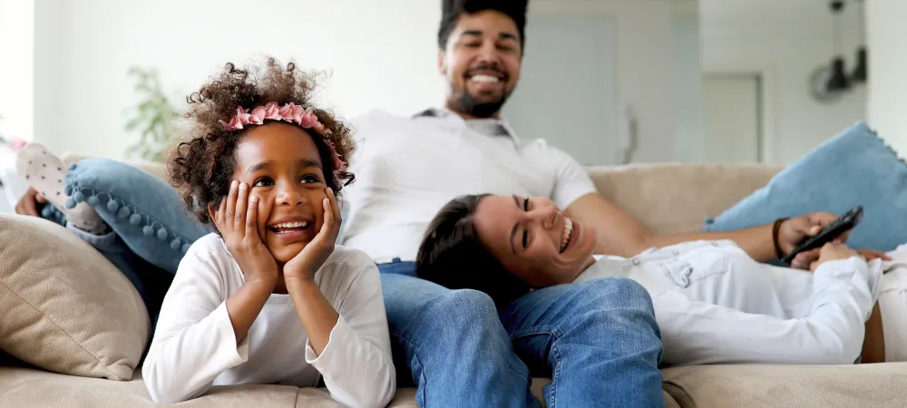 family-on-couch-laughing